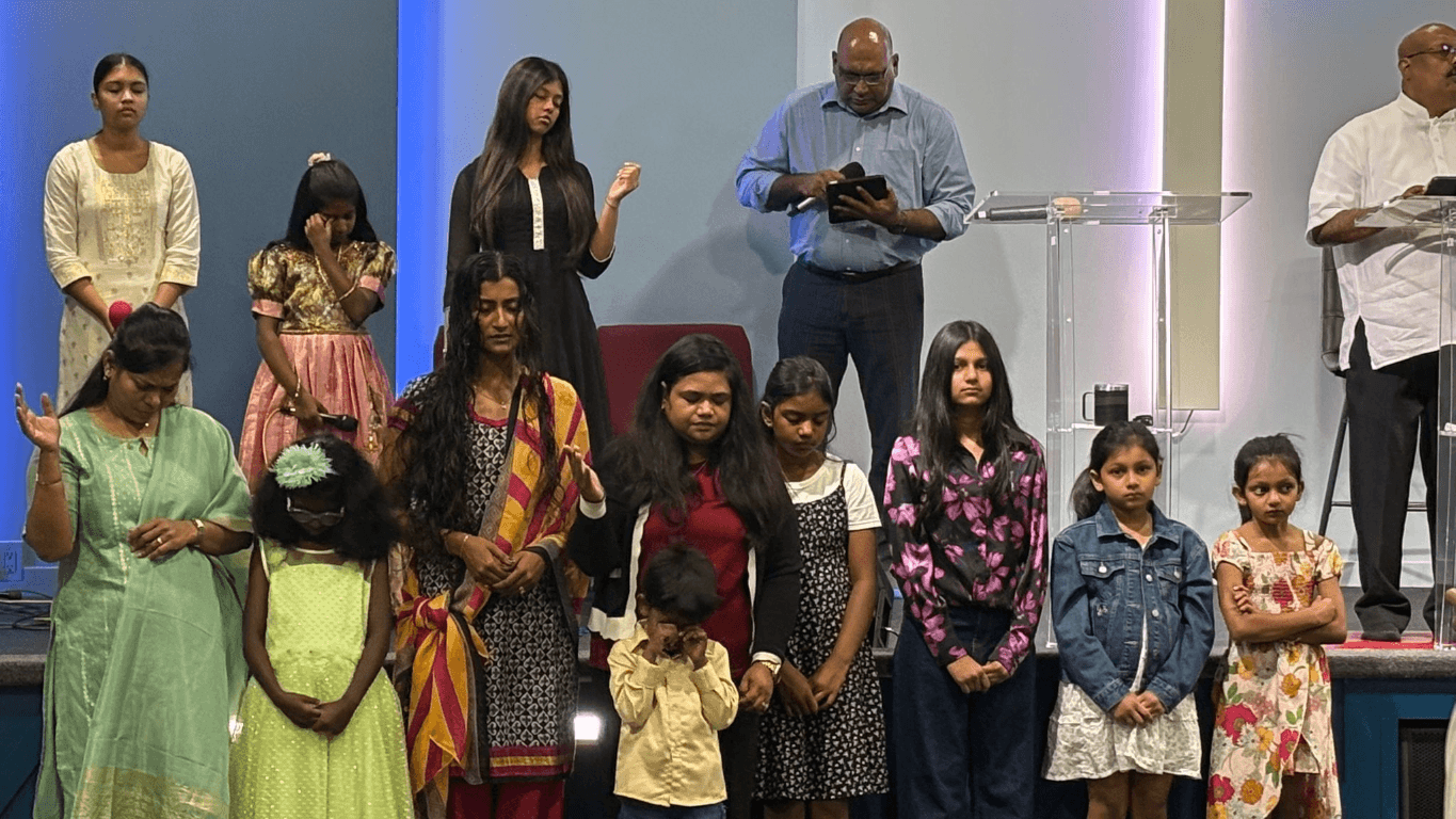 Prayerful congregation worshiping together at Praise Tabernacle
